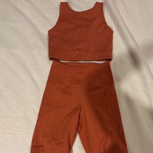 Girlfriend collective set - long line sports bra and long shorts rust/dark orang
